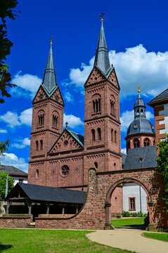 The church Basilica Seligenstadt St. Marcellinus and St. Peter of the monastery Seligenstadt as a parish church with blue sky and sunshine in summer, Seligenstadt, Hessen, Germany