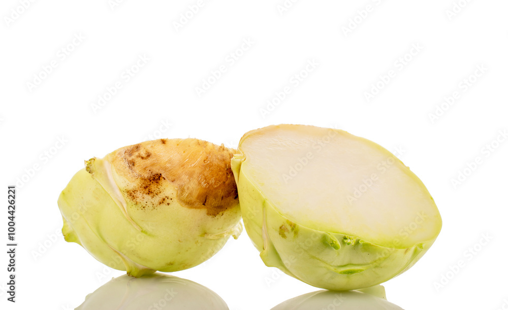 Wall mural one ripe kohlrabi cut in half, macro, isolated on white background.