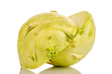 One ripe kohlrabi cut in half, macro, isolated on white background.