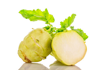 One whole ripe kohlrabi and one half, macro, isolated on white background.