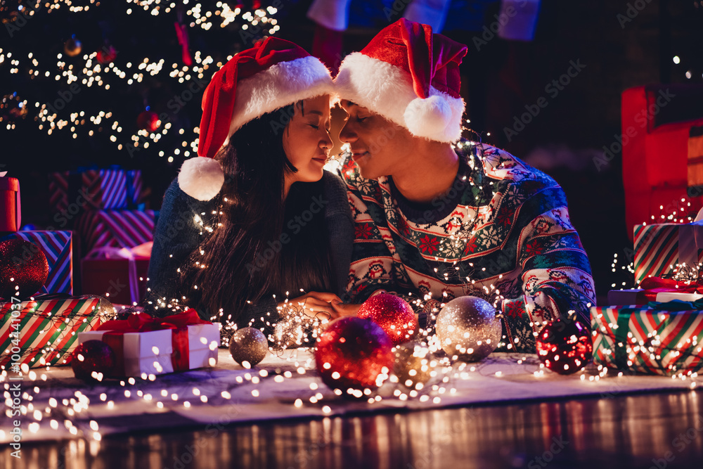 Canvas Prints Photo of two young peaceful partners closed eyes enjoy festive christmas illumination apartment indoors