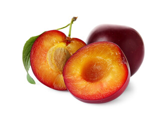 Whole and cut ripe plums isolated on white