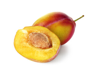Whole and cut ripe plums isolated on white