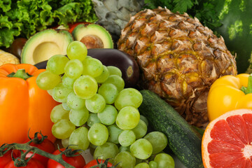 Different fresh vegetables and fruits as background, closeup