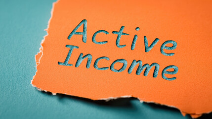 Active income is highlighted on torn orange paper, symbolizing financial concepts and opportunities. This image evokes sense of motivation and focus on earning