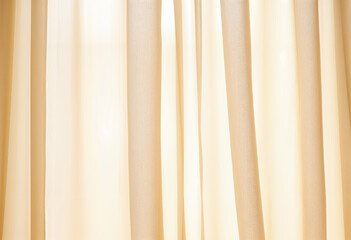 Obraz premium Close-up of a yellow curtain with soft folds and light streaming through it