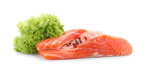 Pieces of fresh salmon, peppercorns and lettuce isolated on white