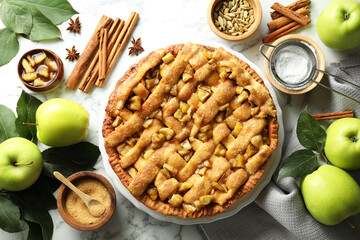 Homemade apple pie and ingredients on white marble table, flat lay