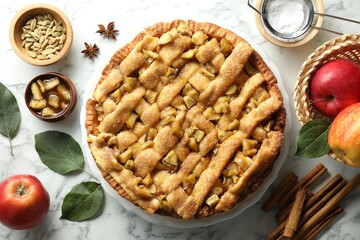 Homemade apple pie and ingredients on white marble table, flat lay