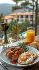 A delicious breakfast spread with eggs, toast, and orange juice against a scenic mountain backdrop
