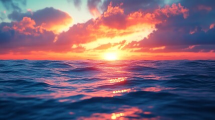 Obraz premium A beautiful sunset over the ocean with the sun reflecting off the water