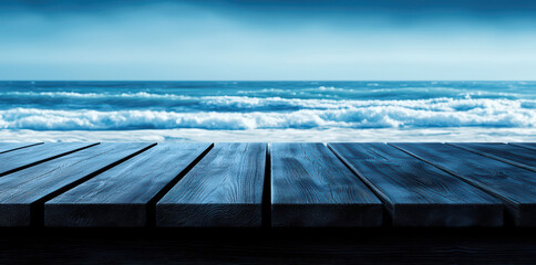 Calm ocean waves crashing against a wooden dock in a serene blue atmosphere.