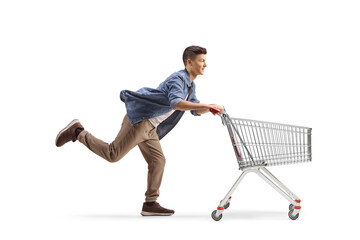 Young man running with a shopping cart