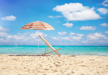Sun lounger and umbrella by the sea