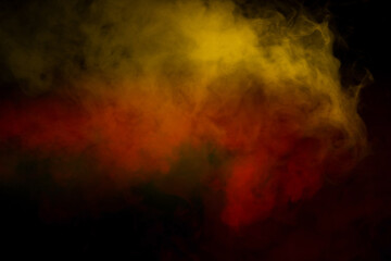 Fototapeta premium Orange and red steam on a black background.