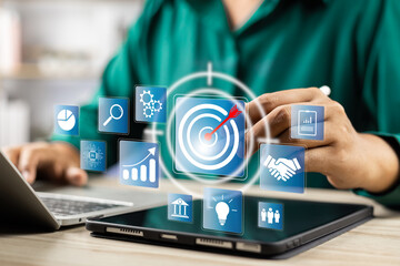 Concept of business strategy and future sustainable business finance action plan. Hand holding target board for creative and set up business objective target and success and business goals concept.