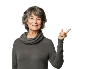 Woman in her 70 pointing up with finger to the side looking to the camera isolated cut out blank background