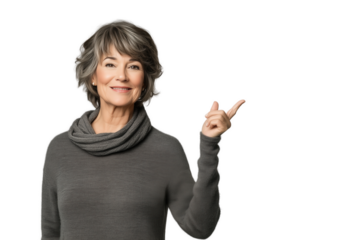 Woman in her 70 pointing up with finger to the side looking to the camera isolated cut out blank background