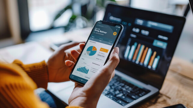 A person using a mobile banking app to check balances, transfer money, and receive real-time updates on financial activities.