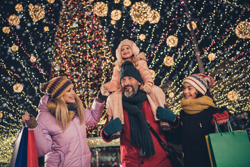 Portrait of attractive cheerful adorable family spending weekend buying gifts things having fun...