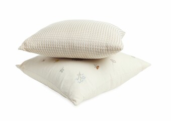 Stack of different pillows isolated on white