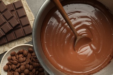 Chocolate dough in bowl and ingredients on grey table, flat lay