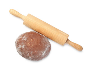Chocolate dough and wooden rolling pin isolated on white, top view