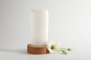 Solid deodorant and beautiful eustoma flower on white background