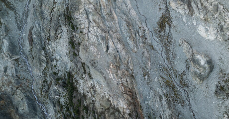 Aerial View of Rugged Rocky Terrain with Water Stream in BC, Canada
