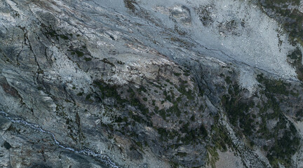 Aerial View of Rugged Mountain Terrain in BC, Canada Featuring Rocky Landscape and Sparse Vegetation