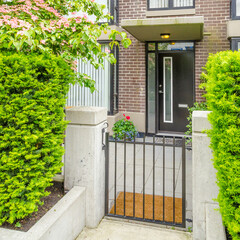 Entrance of luxury house with nice summer landscape at day time in Vancouver, Canada.