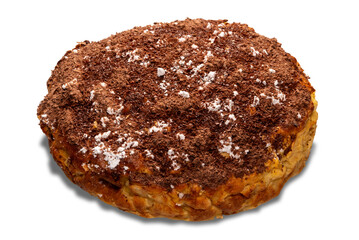 Homemade apple sponge cake covered with grated chocolate and powdered sugar, isolated