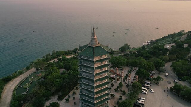 Thap Xa Loi and Lady Buddha in Da Nang, Vietnam at Sunset - Aerial Drone Flight in 4k - Vertical Video