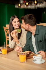 Enjoying a delightful brunch together at a cozy cafe on a sunny afternoon in the heart of the city