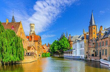 Brugge old town scenic view historical city centre, Rosary Quay embankment with Boutique Hotel, Huis Perez de Malvenda House, De groote Hollander, Belfort Belfry tower, Dijver water canal, Belgium