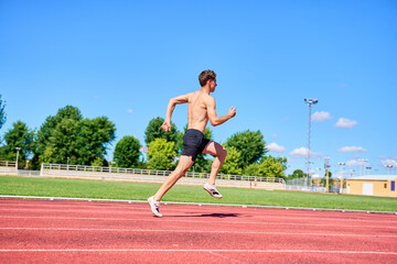 Sprinter running on track during training