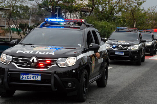 Sequence of civil police cars driving on a street in the city of Sorocaba in Brazil