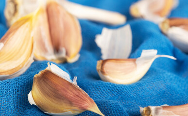 garlic close up on blue background healthy lifestyle