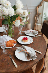 A beautifully set table in the living room for tea and dessert.