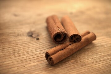 cinnamon sticks on wooden background