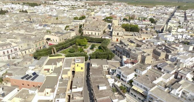 Aerial view of the Manduria municipal villa in the province of Taranto, Italy. In the public park there is a fountain and a war memorial.