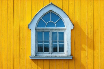 Obraz premium A window with a white frame sits in front of a yellow wall