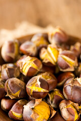 roasted chestnuts in a wood bowl.