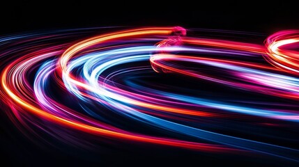 Colorful light trails on black background