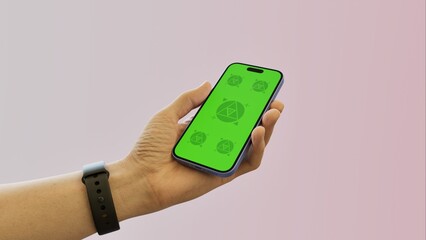 Caucasian White middle aged male using smartphone with a blank green screen. Mobile app mockup. Vertical phone orientation