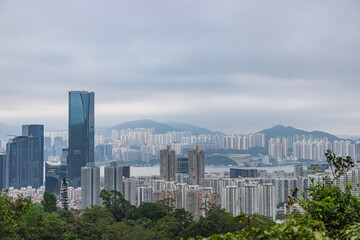 Apartment blocks of Hong Kong Island and East Kowloon at cloudy misty weather, Hong Kong