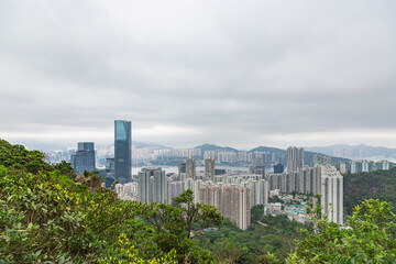 Fototapeta premium Apartment blocks of Hong Kong Island and East Kowloon at cloudy misty weather, Hong Kong