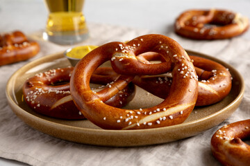 Homemade Bavarian-Style Soft Pretzels with Salt and Beer, side view.