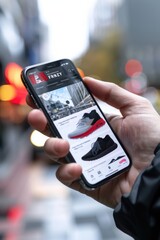 Online Shopping Flash Deals Displayed on Smartphone Screen in Retail Store Setting