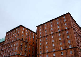 Low angle view of brick buildings against sky